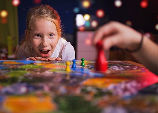 girl playing a board game